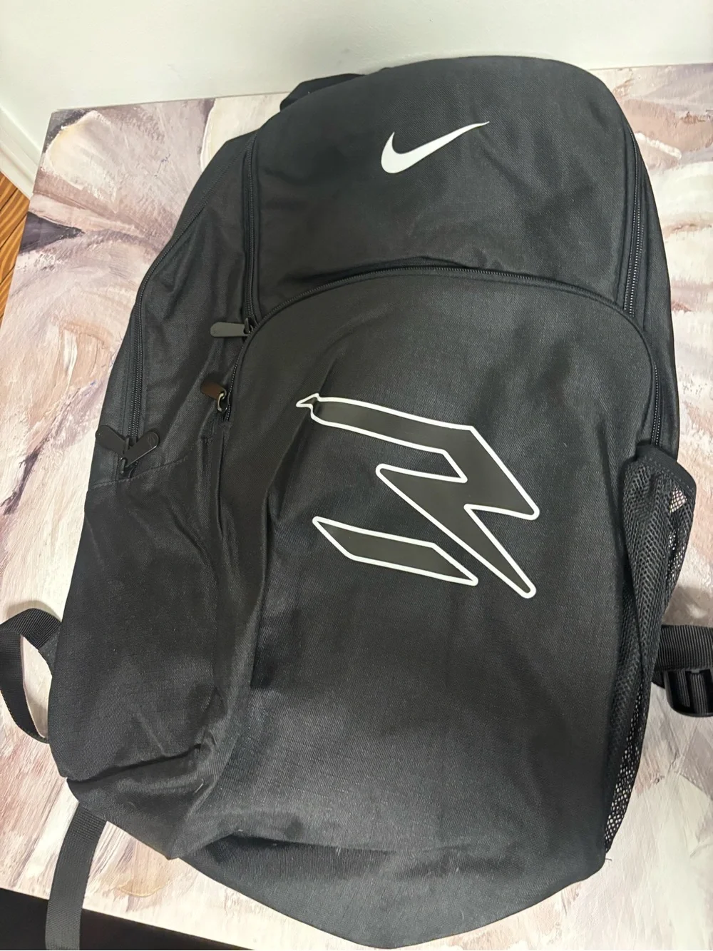 Nike Black Backpack with White Swoosh and Graphic
